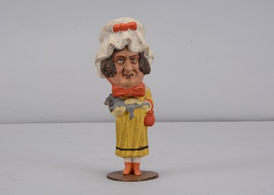 Lot 132 - A 19th century Thüringen ugly lady woman stroking her cat