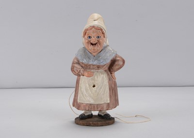 Lot 139 - A late 19th century Thüringen woman with extending long tongue