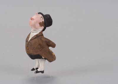 Lot 164 - A mid 19th century German century comic gentleman bristle dancing toy