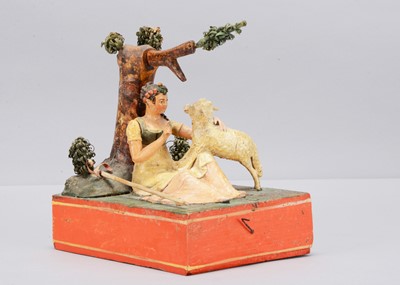 Lot 174 - An 1830s Sonneberg papier-mâché and wood hand-cranked mechanical toy of a shepherdess