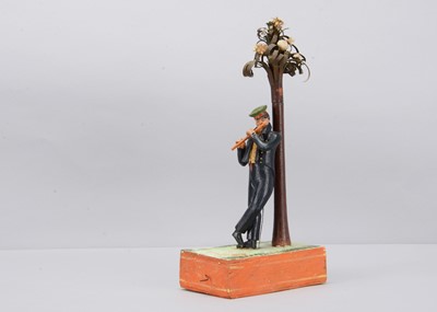 Lot 175 - An 1830s Sonneberg papier-mâché and wood hand-cranked mechanical toy of a student playing a flute