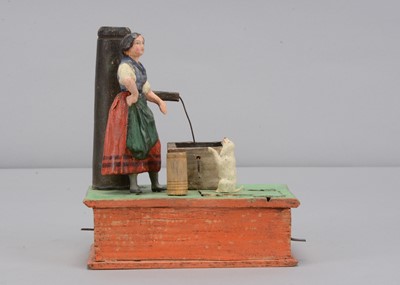 Lot 177 - A mid 19th century Thüringen composition and wooden women at pump