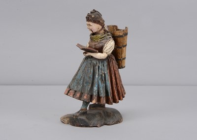 Lot 178 - A mid 19th century Rhöner carved wooden Rhönwackler (nodder) woman grape picker