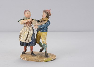 Lot 179 - A mid 19th century Rhöner carved wooden group of two children dancing