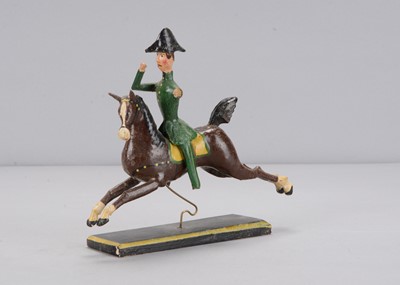 Lot 187 - A mid 19th century Erzgebirge carved wooden huntsman on galloping horse