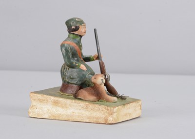 Lot 190 - A mid 19th century Thüringen resting hunter squeak toy