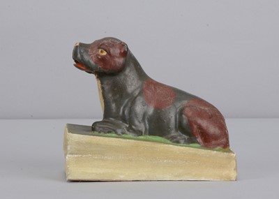 Lot 207 - A mid 19th century Thüringen lying dog squeak toy