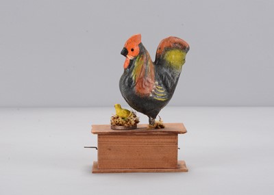 Lot 225 - A mid to late 19th century Thüringen chicken and chick crank toy