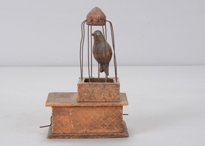 Lot 228 - A mid 19th century Erzgebirge bird in cage crank toy