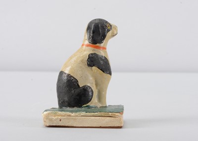 Lot 232 - A mid 19th century Thüringen black and white dog squeak toy