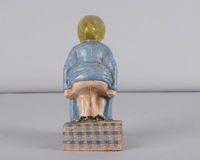 Lot 245 - A mid 19th century Thüringen Dukatenscheißerin woman ‘shitting’money squeak toy