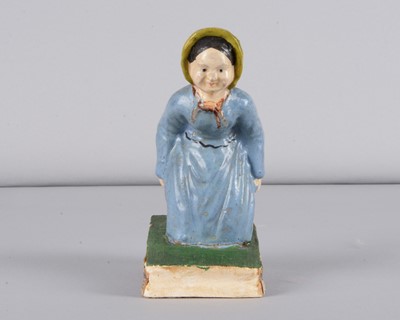 Lot 245 - A mid 19th century Thüringen Dukatenscheißerin woman ‘shitting’money squeak toy