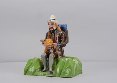 Lot 253 - A late 19th century  Black Forest carved wooden automated figure of a resting traveller dumpling eating