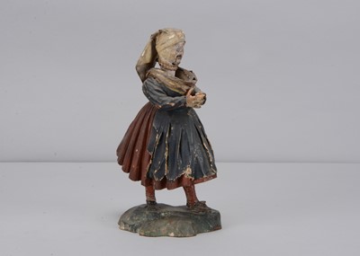 Lot 256 - An 19th century Rhöner papier-mâché and wood Rhönwackler (nodder) woman reading