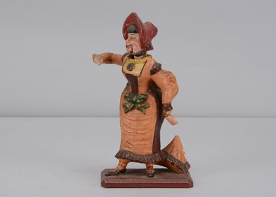 Lot 259 - A mid 19th century Thüringen papier-mâché woman singing figure adopting The Grecian Bend