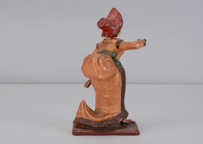 Lot 259 - A mid 19th century Thüringen papier-mâché woman singing figure adopting The Grecian Bend