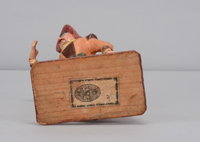 Lot 259 - A mid 19th century Thüringen papier-mâché woman singing figure adopting The Grecian Bend