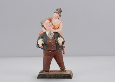 Lot 268 - A mid to late 19th century Thüringen man giving a woman a piggyback swayer