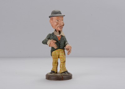 Lot 273 - A late 19th century Thüringen large nosed man nodder