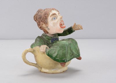 Lot 275 - A late 19th century Thüringen angry woman sitting in a teacup nodder