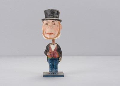 Lot 280 - A late 19th century Thüringen man in top hat nodder