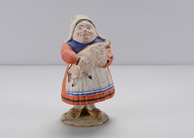 Lot 284 - A mid 19th century Thüringen woman holding a pig swayer