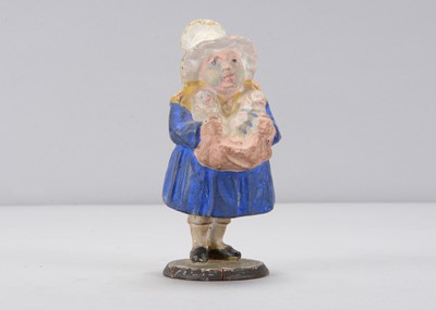 Lot 285 - A mid 19th century Thüringen woman holding babies swayer