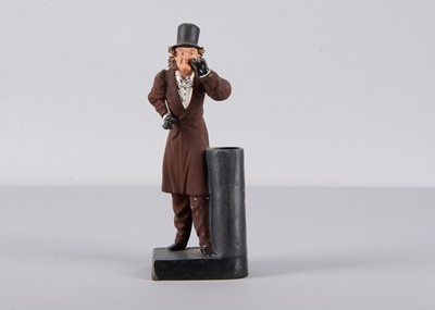 Lot 295 - A late 19th century Thüringen gentleman   peering through an eyeglass spill holder