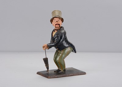 Lot 300 - A mid 19th century Thüringen gentleman with an umbrella nodder