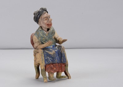 Lot 306 - A late 19th century German composition of a older woman sitting in a chair nodder