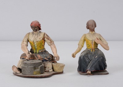 Lot 311 - Two mid 19th century German finely carved wooden women domestic chores