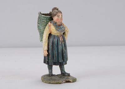 Lot 314 - A mid 19th century Rhöner carved wooden girl carrying basket on back