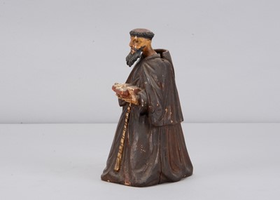 Lot 329 - A mid 19th century carved wooden praying monk nodder