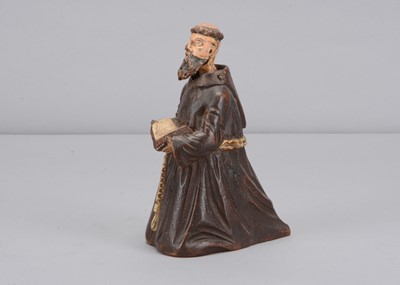 Lot 331 - A mid 19th century carved wooden praying monk nodder