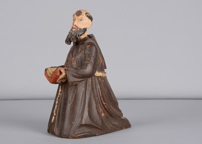 Lot 332 - A mid 19th century carved wooden praying monk nodder