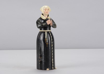 Lot 333 - A mid 19th century Oberammergau wooden figure of a nun with hidden chapel in robes