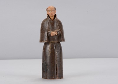 Lot 337 - An early to mid 19th century Oberammergau wooden figure of a monk with hidden chapel in robes