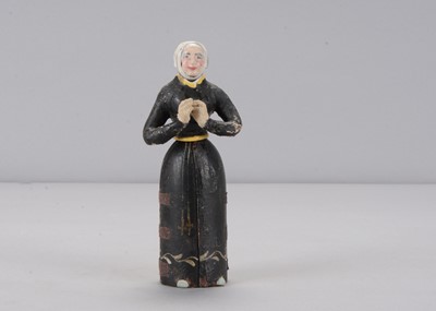 Lot 344 - An early to mid 19th century Oberammergau wooden figure of a nun with hidden chapel in robes