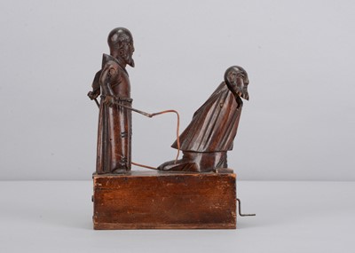 Lot 347 - An 19th century Grödnertal carved wooden hand cranked toy of flagellating monks