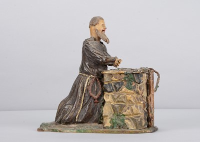 Lot 348 - An 19th century Rhöner carved wooden nodding praying monk