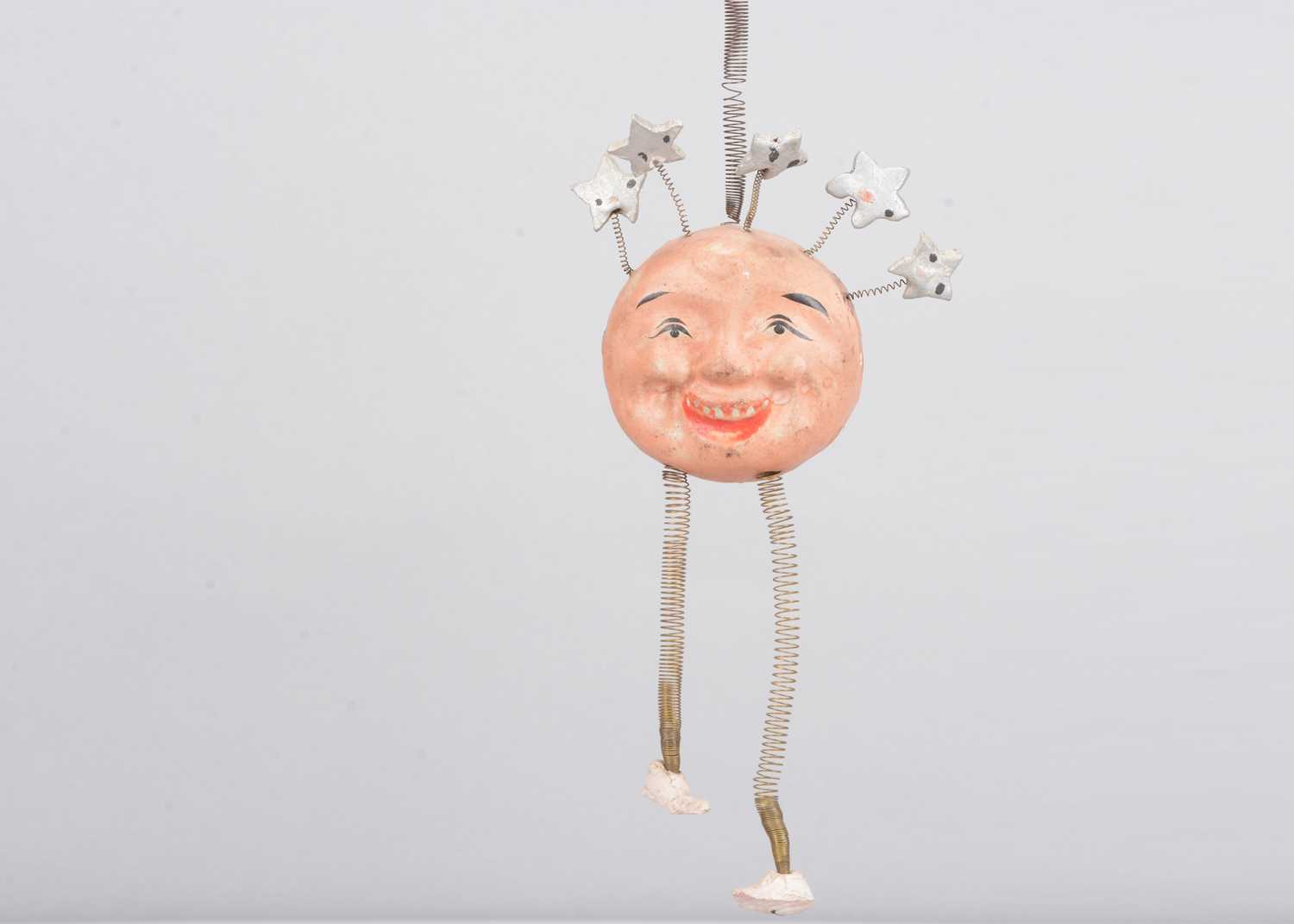 Lot 350 - A late 19th century German man in the moon hanging toy, possibly a Christmas decoration