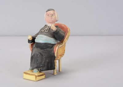 Lot 355 - A late 19th century seated priest nodder