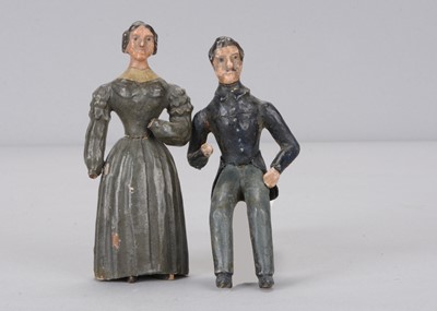 Lot 364 - A mid 19th century Seiffen carved wooden couple, possibly personalities