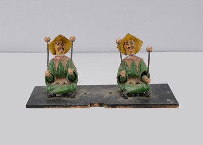 Lot 365 - A late 19th century pair of cast metal Chinamen probably from a music box mechanism