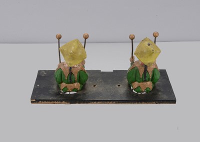 Lot 365 - A late 19th century pair of cast metal Chinamen probably from a music box mechanism