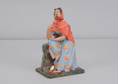 Lot 366 - A mid 19th century Thüringen smoking gypsy woman nodder