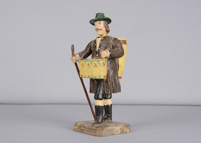 Lot 372 - An 19th century German carved wooden man pedlar