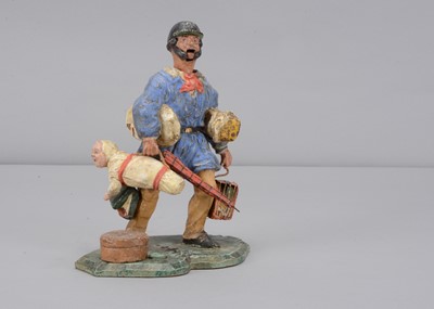 Lot 386 - A mid 19th century German papier-mâché delivery man nodder