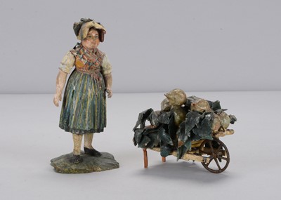 Lot 393 - A mid 19th century Rhöner carved wooden girl turnip seller