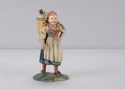 Lot 394 - A mid 19th century Rhöner carved wooden market girl